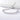 Silver-tone adjustable tennis bracelet with cubic zirconia laid on a white surface