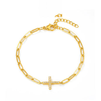 Pulsera de eslabones alargados en tono dorado con cruz
