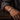 Man wearing silver-tone Cuban chain bracelet with custom engraved clasp on wrist
