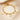 Gold paperclip chain bracelet with letter O charm, round coin charms and bead charms