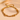 Gold-tone layered bead chain bracelet on peach surface with extension chain