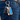 Blue engraved rectangular keychain clipped to jeans beside keys