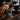Blue engraved rectangular keychain beside car keys and a coffee cup