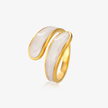 gold-tone open wrap ring with white marbled inlay on a light background