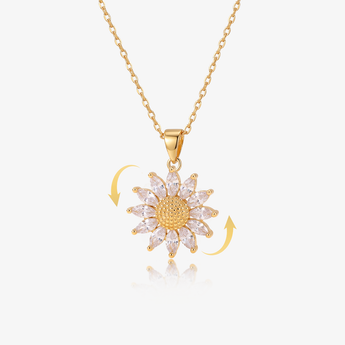 gold-tone rotatable sunflower pendant necklace with cubic zirconia petals and rotation arrows