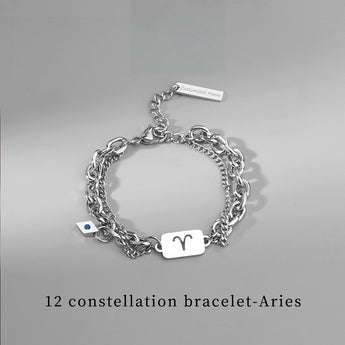 Silver-tone Aries zodiac charm bracelet with custom engraved tag