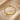 Gold-tone curved bar bracelet for women with a bow charm, engraved