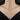 Model wearing a gold-tone tassel butterfly pendant necklace with a black top