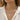 Woman wearing a silver-tone cross pendant rope chain necklace with a white linen shirt