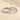 Pair of engraved silver-tone couple rings on a beige background