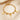 Gold paperclip chain bracelet with letter T charm, round coin charms and bead charms