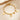 Gold paperclip chain bracelet with letter D charm, round coin charms and bead charms