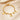 Gold paperclip chain bracelet with letter G charm, round coin charms and bead charms