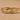 Two gold-tone engraved open wrap rings with Forever and Love U text on a beige surface
