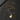 Gold-tone guitar pendant necklace engraved with Forever laid out on a dark surface with the box chain