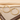 Pair of gold-tone large hoop earrings resting on cream fabric