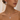 Woman wearing a silver-tone round stone pendant necklace and matching earrings